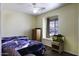 Modest bedroom with a bed, a fish tank, and a window at 1623 E Krystal St, Casa Grande, AZ 85122