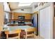 Bright kitchen with a skylight features wooden cabinets, tiled backsplash, and stainless steel appliances at 1623 E Krystal St, Casa Grande, AZ 85122