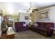 Comfortable living room with plush furniture, carpet flooring, and a view into the dining area at 1623 E Krystal St, Casa Grande, AZ 85122