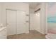 bedroom with a closet, storage, and neutral walls, with a view of a ocean wall paper at 19834 N Tammy St, Maricopa, AZ 85138