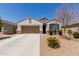 Charming single-story home with a two-car garage and low-maintenance desert landscaping at 19834 N Tammy St, Maricopa, AZ 85138