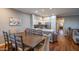 Open-concept dining area featuring a wooden table, seating for eight, and views of the modern kitchen at 20100 N 78Th Pl # 3126, Scottsdale, AZ 85255
