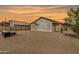 Spacious backyard offering a patio area, desert landscaping and privacy fence at 2030 S 86Th Dr, Tolleson, AZ 85353