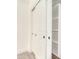 This spacious closet offers ample storage with built-in shelving and double doors for organized convenience at 2030 S 86Th Dr, Tolleson, AZ 85353