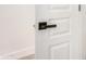 Close-up of a modern door handle with sleek design, enhancing the contemporary look of the home's interior at 2030 S 86Th Dr, Tolleson, AZ 85353