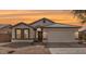 Charming single-story home with well-maintained landscaping, neutral color palette, and attached two-car garage at 2030 S 86Th Dr, Tolleson, AZ 85353