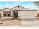 Charming single-story home featuring a well-maintained front yard and two-car garage at 2030 S 86Th Dr, Tolleson, AZ 85353