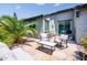 Well-appointed backyard patio with comfortable seating and a barbecue grill at 21150 N Evergreen Dr, Maricopa, AZ 85138