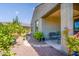 Charming covered patio with outdoor seating and landscaped surroundings at 21150 N Evergreen Dr, Maricopa, AZ 85138