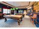 Fun billiard room featuring pool tables, pendant lighting, and comfortable seating for hours of entertainment at 21150 N Evergreen Dr, Maricopa, AZ 85138