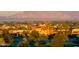 Beautiful homes surrounded by mature trees and landscaping with mountain views in the background at 21150 N Evergreen Dr, Maricopa, AZ 85138