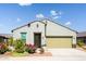 Charming single-story home with a well-maintained front yard and a two-car garage at 21150 N Evergreen Dr, Maricopa, AZ 85138