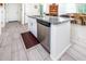 Kitchen island features granite countertops, stainless steel dishwasher, and a convenient breakfast bar at 21150 N Evergreen Dr, Maricopa, AZ 85138