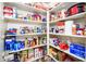 Walk-in pantry with organized shelving offering ample storage space for food and household items at 21150 N Evergreen Dr, Maricopa, AZ 85138