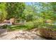 Picturesque backyard with beautiful landscaping and vibrant rose bushes, providing a serene and inviting outdoor space at 2160 E Kenwood St, Mesa, AZ 85213