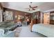 Cozy primary bedroom showcases classic furniture, a ceiling fan and plush carpeting at 2160 E Kenwood St, Mesa, AZ 85213