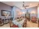 Formal dining room with a traditional table and chairs with a ceiling fan at 2160 E Kenwood St, Mesa, AZ 85213