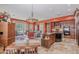 Open-concept kitchen and dining area with tile floors, seamlessly blending into a cozy living space, ideal for entertaining at 2160 E Kenwood St, Mesa, AZ 85213