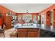 Kitchen with a central island, a sink, and lots of natural light from the windows at 2160 E Kenwood St, Mesa, AZ 85213