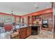 Spacious kitchen with wooden cabinets, a central island, and modern appliances at 2160 E Kenwood St, Mesa, AZ 85213