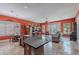 Open-concept living space featuring a spacious kitchen island and views into the cozy living room and dining area at 2160 E Kenwood St, Mesa, AZ 85213