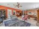 Open-plan living room and kitchen with a rug and lots of seating at 2160 E Kenwood St, Mesa, AZ 85213