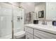 Bathroom with walk-in shower, white sink, and modern hardware and towel at 2229 N 139Th Dr, Goodyear, AZ 85395