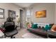 Office space with modern desk chair, couch, and diplomas hanging on the wall at 2229 N 139Th Dr, Goodyear, AZ 85395