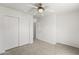 Bedroom featuring neutral carpeting, ceiling fan and sliding door closet at 2337 E Fraktur Rd, Phoenix, AZ 85040