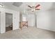 Bright bonus room showcasing plush carpeting and a ceiling fan, with multiple entryways at 2337 E Fraktur Rd, Phoenix, AZ 85040