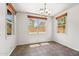 Well-lit dining area features tile flooring and natural light streaming through three windows at 2337 E Fraktur Rd, Phoenix, AZ 85040