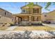 Inviting two-story home featuring a covered porch, shutters, and well-kept landscaping at 2337 E Fraktur Rd, Phoenix, AZ 85040