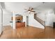 Open-concept living room connects to the kitchen, showcasing hardwood floors and staircase at 2337 E Fraktur Rd, Phoenix, AZ 85040