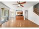Bright, open living room with hardwood floors leading to the kitchen and dining area at 2337 E Fraktur Rd, Phoenix, AZ 85040
