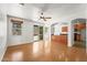 Open-concept living room with wood floors and seamless flow to the kitchen at 2337 E Fraktur Rd, Phoenix, AZ 85040