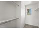 Walk-in closet with built-in shelving and natural light from the window at 2337 E Fraktur Rd, Phoenix, AZ 85040