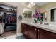 Bathroom with double sinks, and closet featuring ample storage space at 23707 W Hess Ave, Buckeye, AZ 85326
