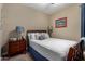 Bedroom featuring a twin bed and nightstand at 23707 W Hess Ave, Buckeye, AZ 85326