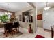 Dining room with tile flooring, elegant chandelier, and natural light at 23707 W Hess Ave, Buckeye, AZ 85326