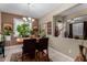 Dining room with tile flooring, elegant chandelier, and natural light at 23707 W Hess Ave, Buckeye, AZ 85326