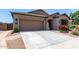 Charming single-story home with desert landscaping, and a two-car garage at 23707 W Hess Ave, Buckeye, AZ 85326