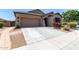 Charming single-story home with desert landscaping, and a two-car garage at 23707 W Hess Ave, Buckeye, AZ 85326
