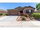 Charming single-story home with desert landscaping, and a two-car garage at 23707 W Hess Ave, Buckeye, AZ 85326