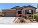 Charming single-story home with desert landscaping, and a two-car garage at 23707 W Hess Ave, Buckeye, AZ 85326