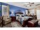 Spacious main bedroom featuring a decorative bed and large windows at 23707 W Hess Ave, Buckeye, AZ 85326