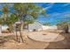 Backyard with a covered patio, a fire pit, landscaping, and grey siding on the home at 2388 S Vista Rd, Apache Junction, AZ 85119