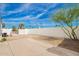 Backyard patio area surrounded by a white fence and blue skies, great space for entertaining at 2388 S Vista Rd, Apache Junction, AZ 85119