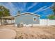 Exterior backyard view showing the house, covered patio, and ample outdoor space at 2388 S Vista Rd, Apache Junction, AZ 85119
