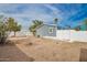 View of the backyard with ample outdoor space, grey siding, and a privacy fence at 2388 S Vista Rd, Apache Junction, AZ 85119