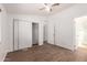 Bedroom featuring closet, vinyl floors, neutral walls and a bathroom en-suite at 2388 S Vista Rd, Apache Junction, AZ 85119